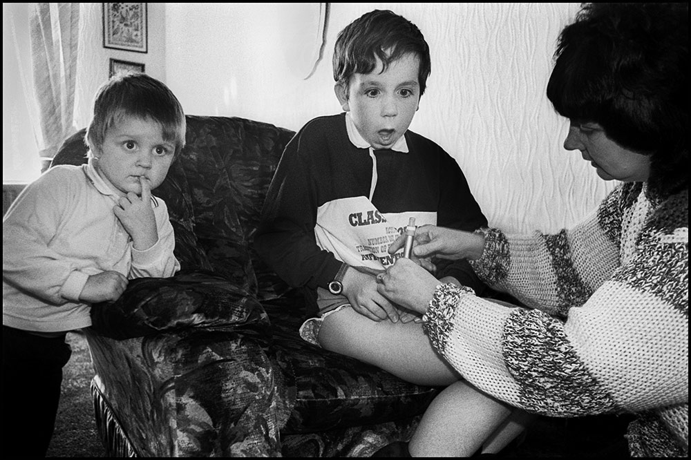1994- SELLAFIELD NUCLEAR - Workington, Lin Mar gives her son Ronnie a daily injection. Ronnie has leukaemia. His father worked on the Sellafield terrain